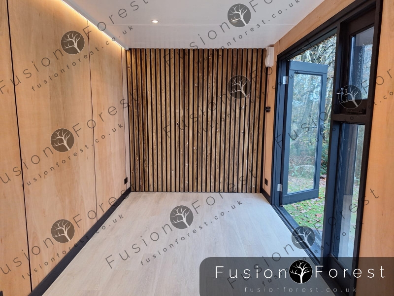 Shipping container conversion interior with timber cladding in Ashford
