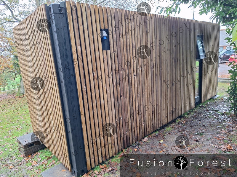 Exterior fully cladded shipping container conversion by Fusion Forest