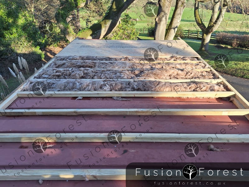 Roof insulation in container conversion near Ashford